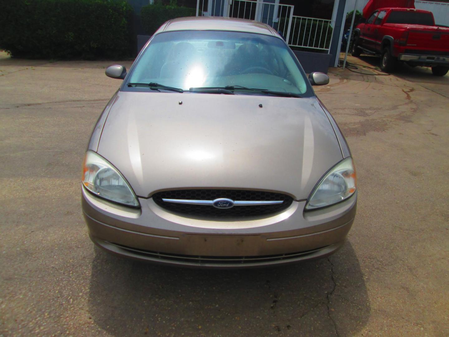 2003 GOLD /TAN Ford Taurus SES FFV (1FAFP552X3G) with an 3.0L V6 OHV 12V FFV engine, 4-Speed Automatic Overdrive transmission, located at 1815 NE 28th St., Fort Worth, TX, 76106, (817) 625-6251, 32.795582, -97.333069 - Photo#1