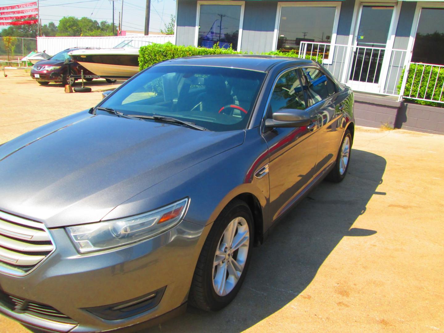 2014 GRAY Ford Taurus SEL FWD (1FAHP2E80EG) with an 3.5L V6 DOHC 24V engine, 6-Speed Automatic transmission, located at 1815 NE 28th St., Fort Worth, TX, 76106, (817) 625-6251, 32.795582, -97.333069 - Photo#0