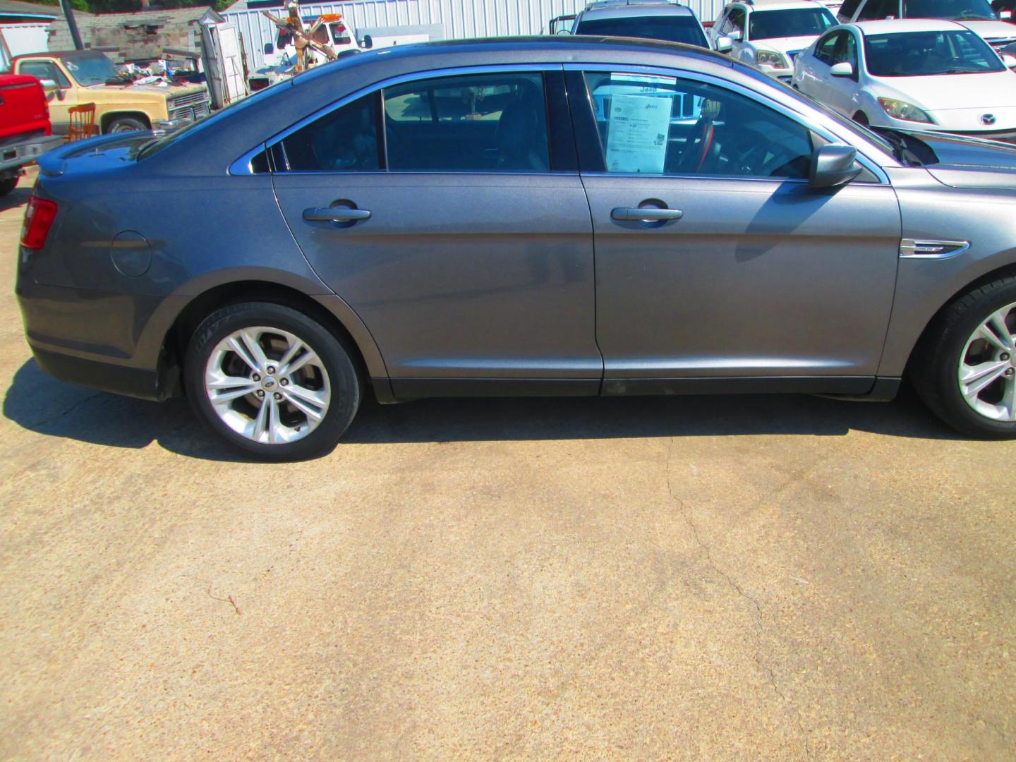 2014 GRAY Ford Taurus SEL FWD (1FAHP2E80EG) with an 3.5L V6 DOHC 24V engine, 6-Speed Automatic transmission, located at 1815 NE 28th St., Fort Worth, TX, 76106, (817) 625-6251, 32.795582, -97.333069 - Photo#3