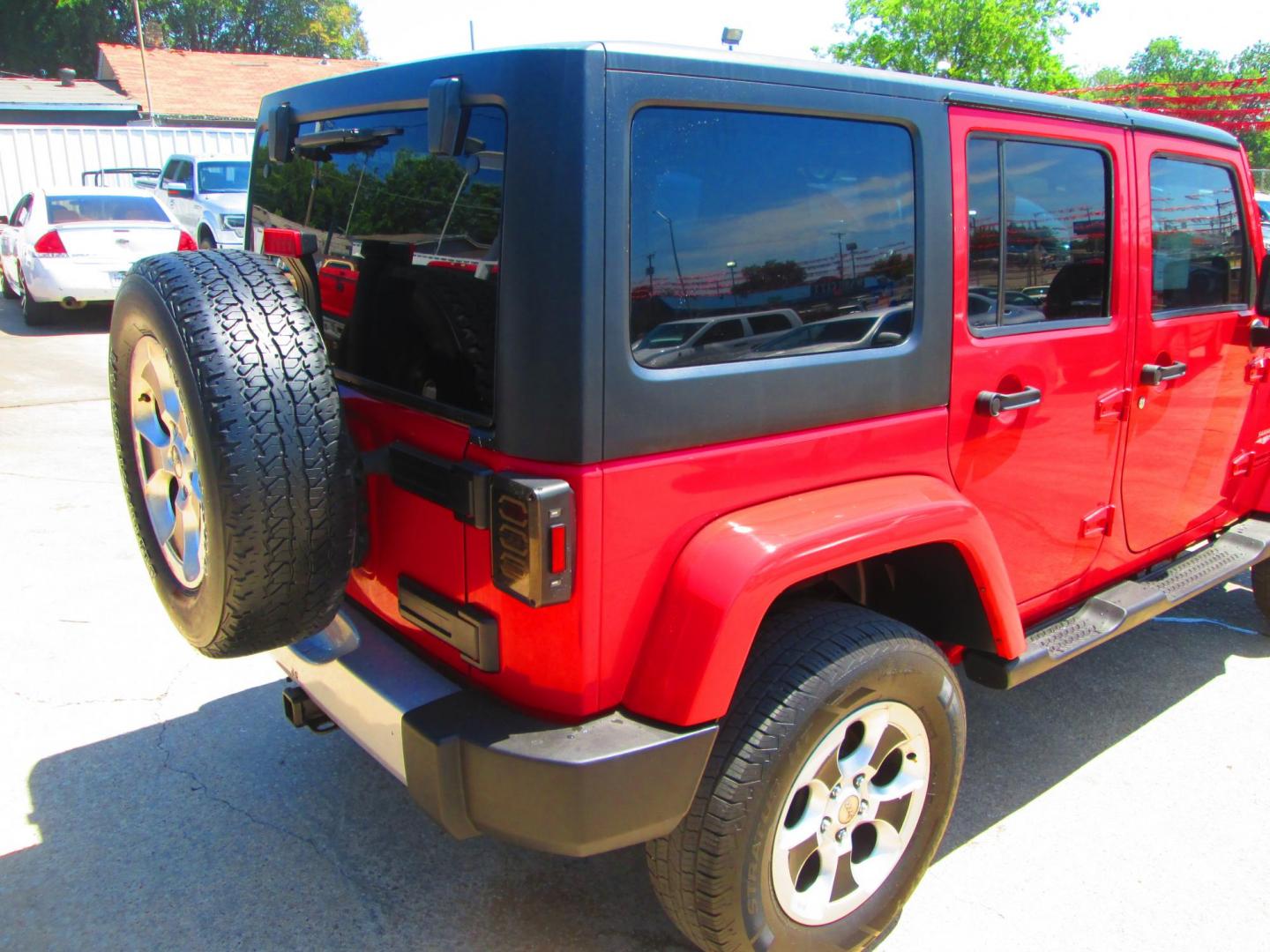2013 RED Jeep Wrangler Unlimited Sahara 4WD (1C4HJWEG9DL) with an 3.6L V6 DOHC 24V FFV engine, located at 1815 NE 28th St., Fort Worth, TX, 76106, (817) 625-6251, 32.795582, -97.333069 - Photo#4