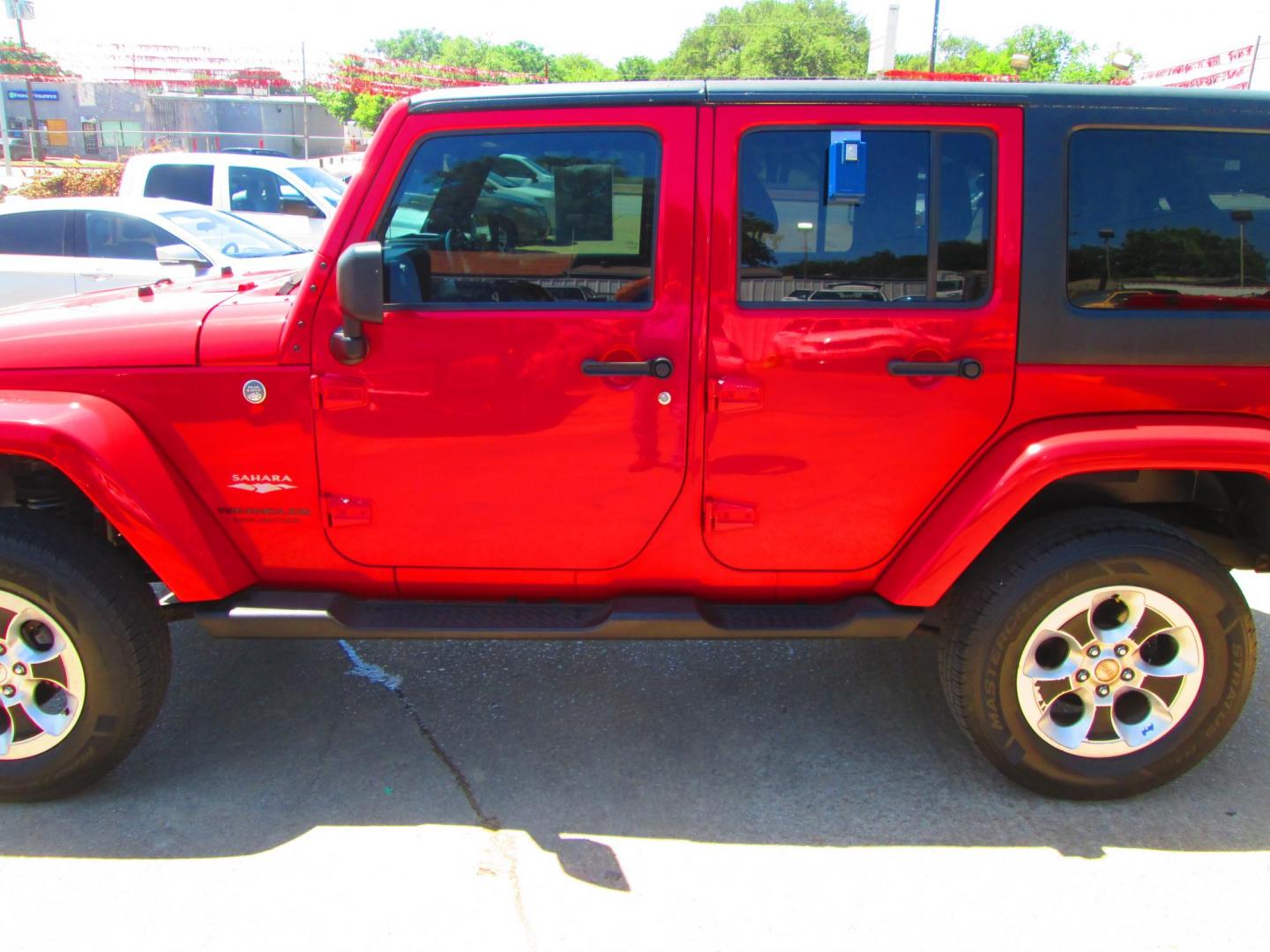 2013 RED Jeep Wrangler Unlimited Sahara 4WD (1C4HJWEG9DL) with an 3.6L V6 DOHC 24V FFV engine, located at 1815 NE 28th St., Fort Worth, TX, 76106, (817) 625-6251, 32.795582, -97.333069 - Photo#7