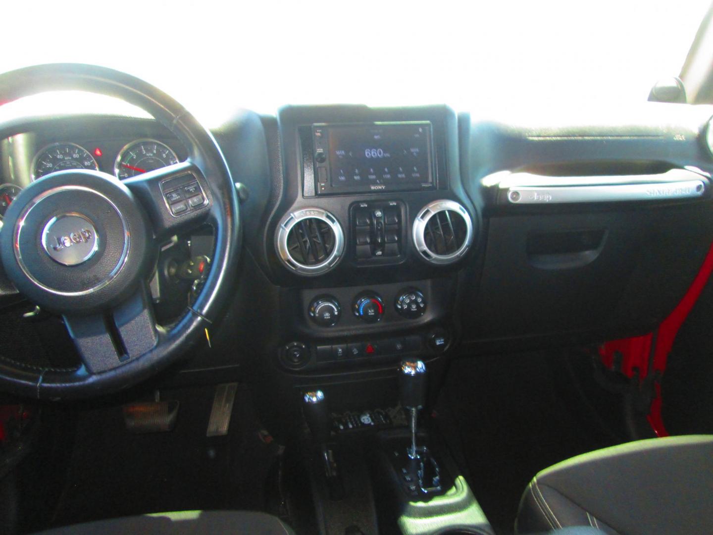 2013 RED Jeep Wrangler Unlimited Sahara 4WD (1C4HJWEG9DL) with an 3.6L V6 DOHC 24V FFV engine, located at 1815 NE 28th St., Fort Worth, TX, 76106, (817) 625-6251, 32.795582, -97.333069 - Photo#9