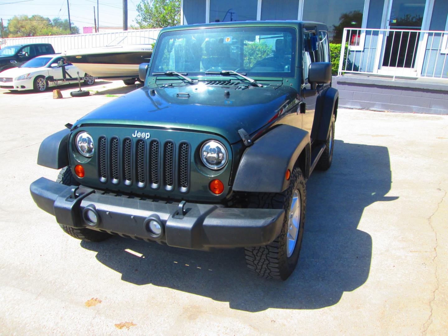 2010 GREEN Jeep Wrangler Sport 4WD (1J4AA2D12AL) with an 3.8L V6 OHV 12V engine, located at 1815 NE 28th St., Fort Worth, TX, 76106, (817) 625-6251, 32.795582, -97.333069- Photo#0