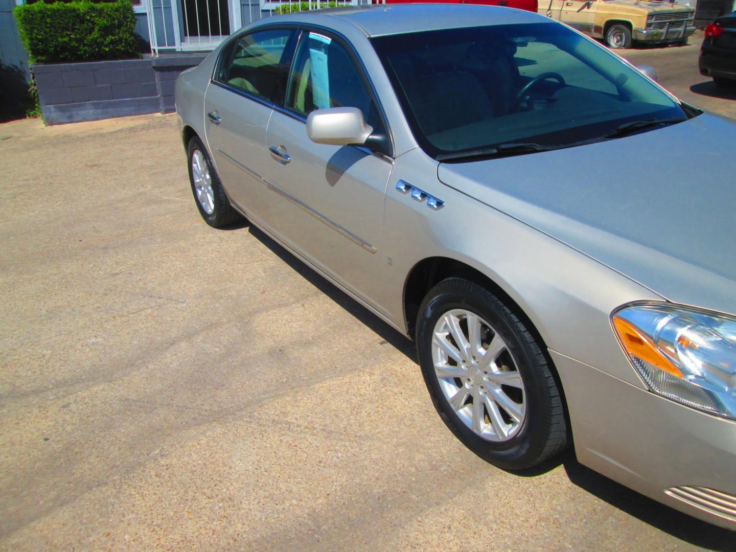 2009 GOLD Buick Lucerne CXL1 (1G4HD57M79U) with an 3.9L V6 OHV 12V engine, 4A transmission, located at 1815 NE 28th St., Fort Worth, TX, 76106, (817) 625-6251, 32.795582, -97.333069- Photo#2